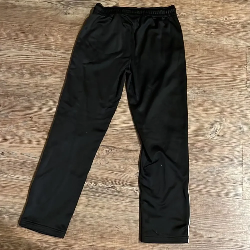 TCP youth boys size 10/12 black athletic pants with white stripe.